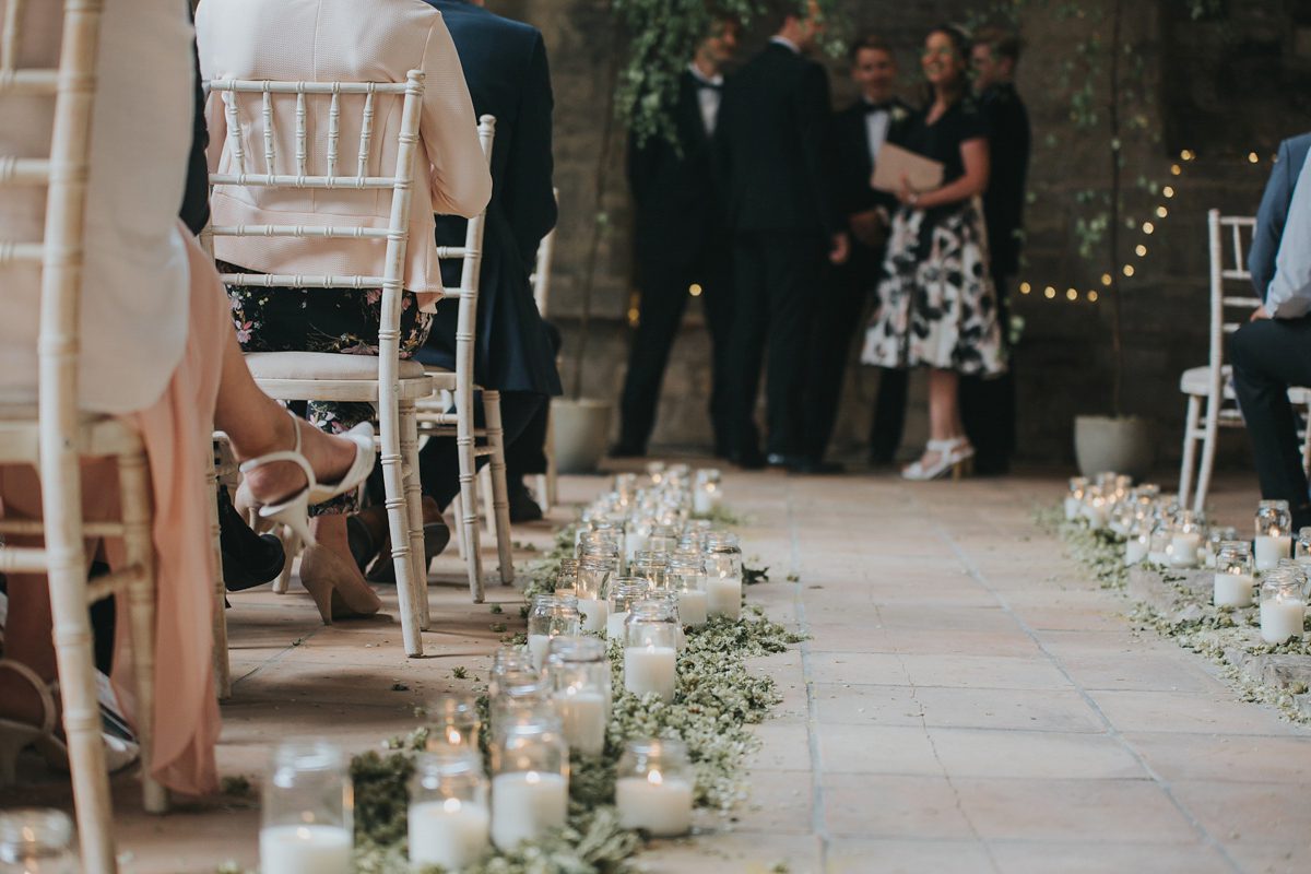 Barefoot bride Zoё wore a dress she had designed herself for her effortlessly elegant wedding at Blackfriar medieval priory in Gloucester. Captured by Grace Elizabeth Photography.