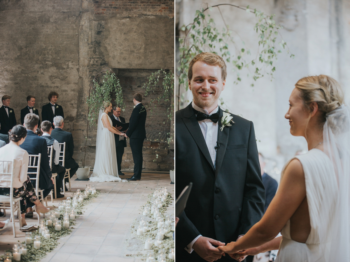 Barefoot bride Zoё wore a dress she had designed herself for her effortlessly elegant wedding at Blackfriar medieval priory in Gloucester. Captured by Grace Elizabeth Photography.