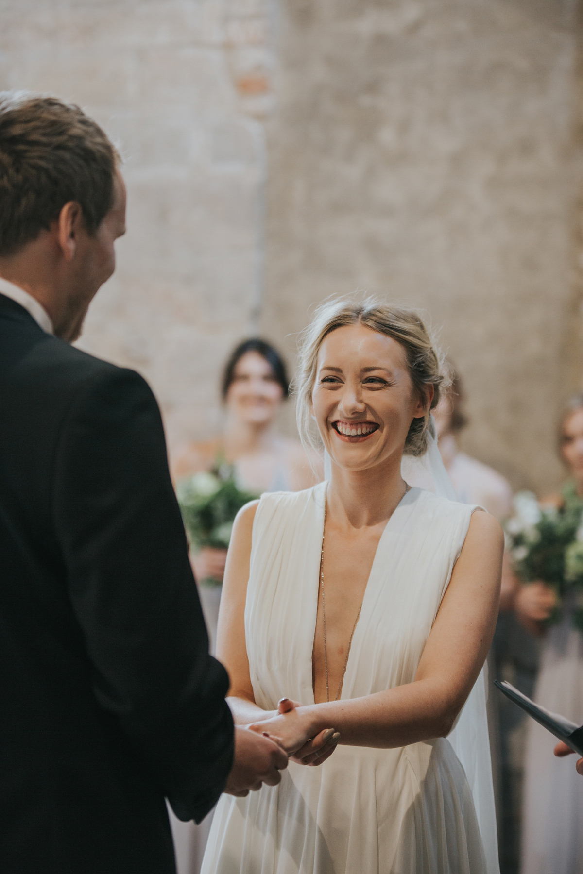 Barefoot bride Zoё wore a dress she had designed herself for her effortlessly elegant wedding at Blackfriar medieval priory in Gloucester. Captured by Grace Elizabeth Photography.