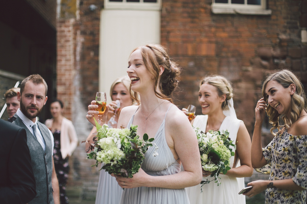 Barefoot bride Zoё wore a dress she had designed herself for her effortlessly elegant wedding at Blackfriar medieval priory in Gloucester. Captured by Grace Elizabeth Photography.