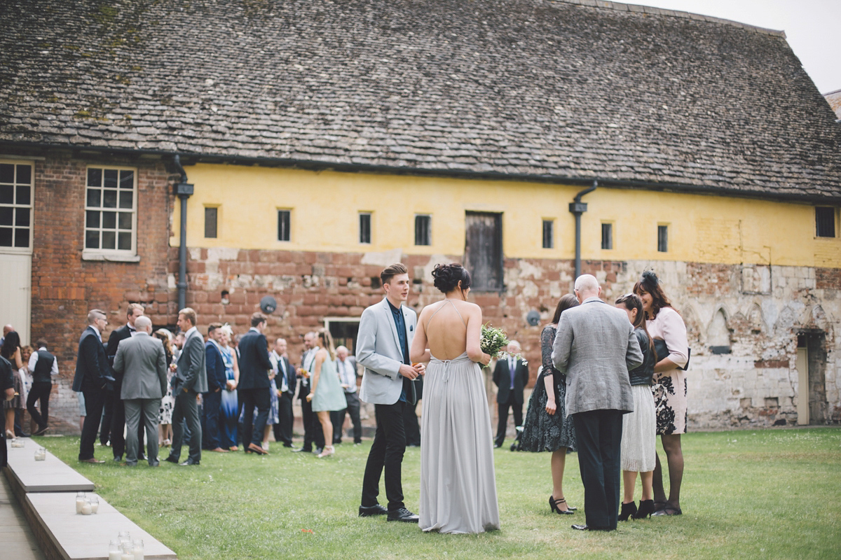 Barefoot bride Zoё wore a dress she had designed herself for her effortlessly elegant wedding at Blackfriar medieval priory in Gloucester. Captured by Grace Elizabeth Photography.