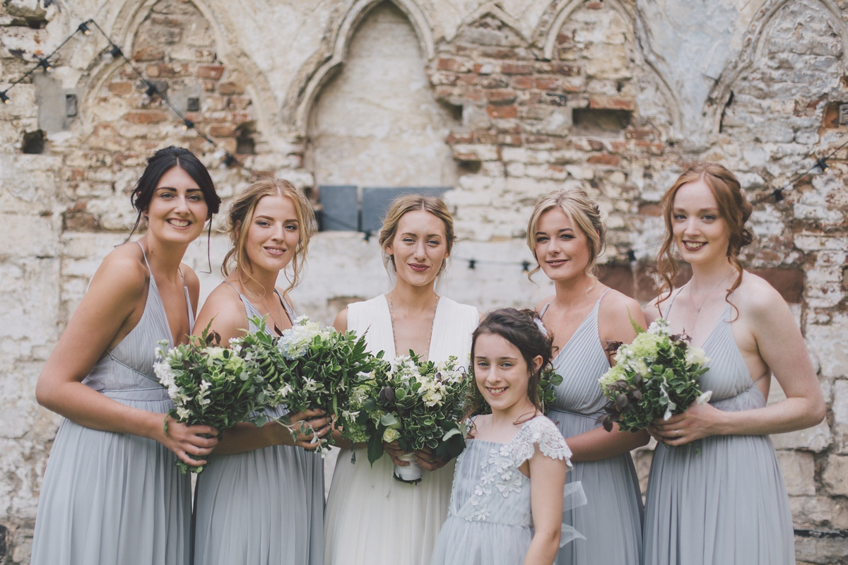 Barefoot bride Zoё wore a dress she had designed herself for her effortlessly elegant wedding at Blackfriar medieval priory in Gloucester. Captured by Grace Elizabeth Photography.