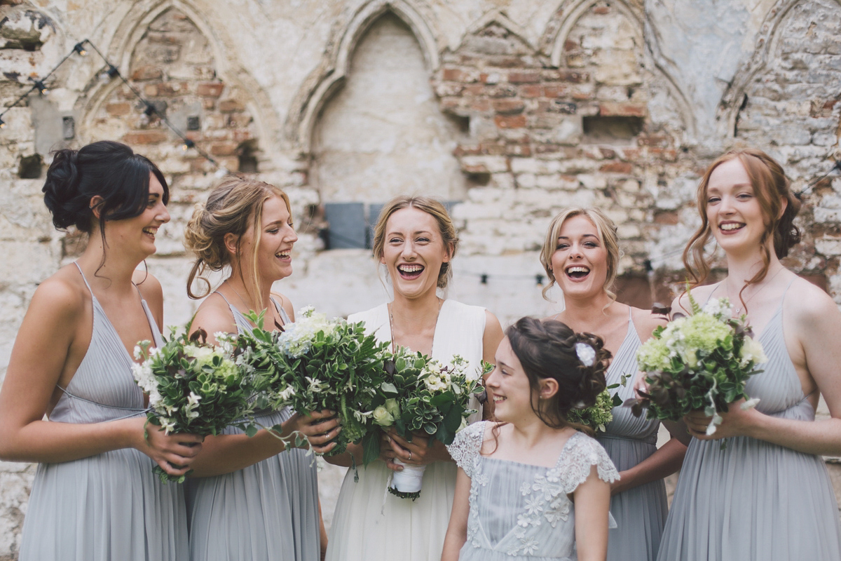 Barefoot bride Zoё wore a dress she had designed herself for her effortlessly elegant wedding at Blackfriar medieval priory in Gloucester. Captured by Grace Elizabeth Photography.