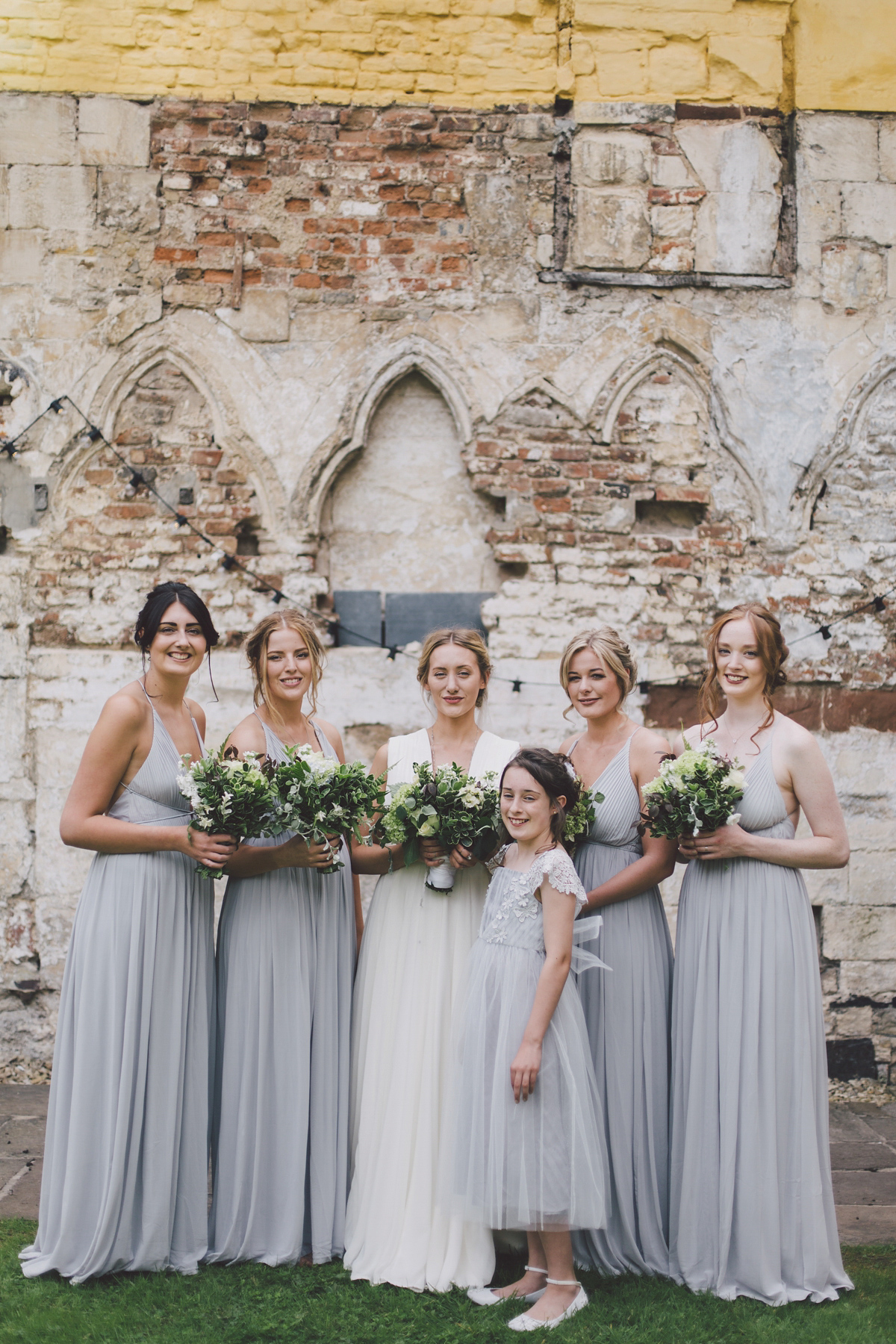 Barefoot bride Zoё wore a dress she had designed herself for her effortlessly elegant wedding at Blackfriar medieval priory in Gloucester. Captured by Grace Elizabeth Photography.