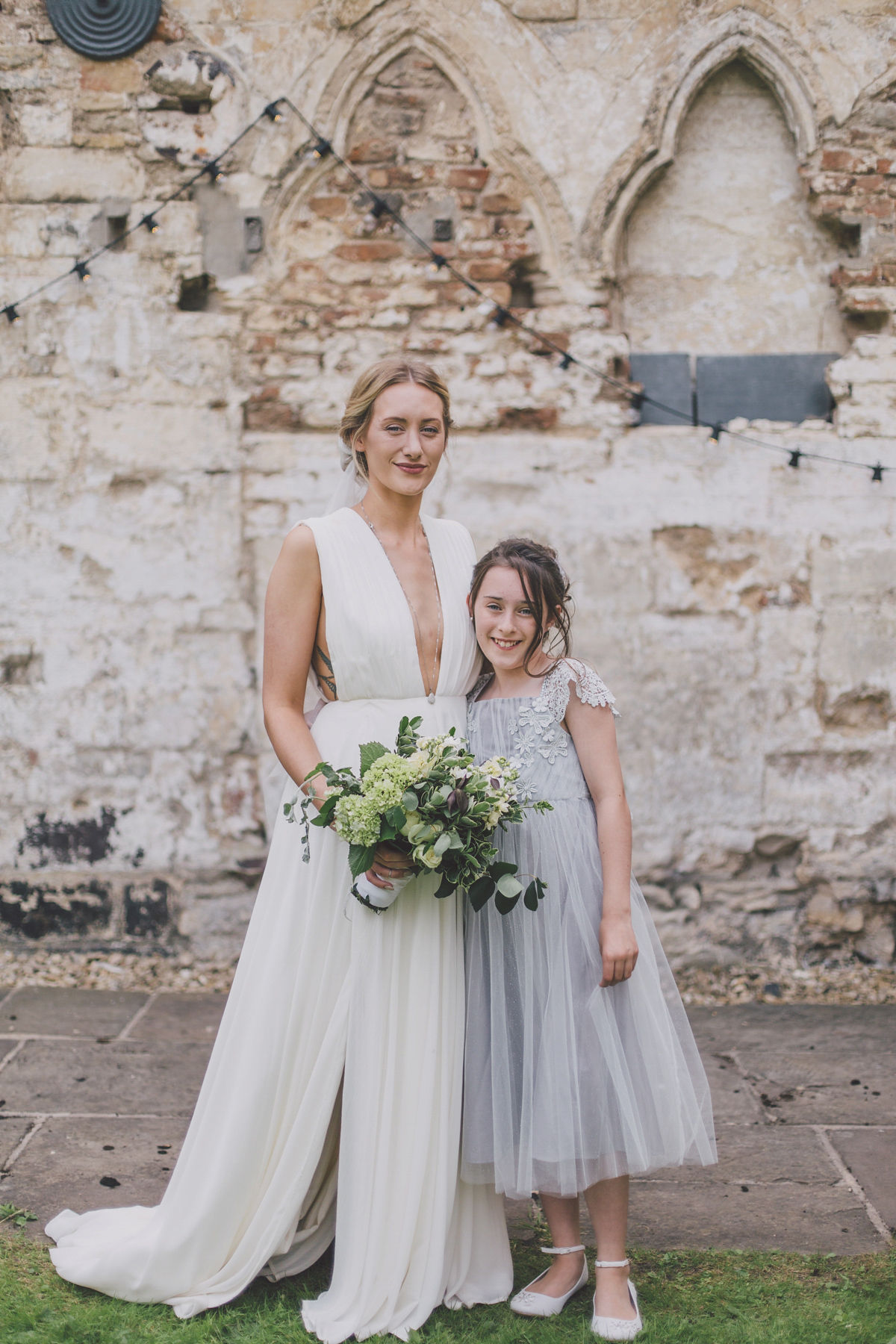 Barefoot bride Zoё wore a dress she had designed herself for her effortlessly elegant wedding at Blackfriar medieval priory in Gloucester. Captured by Grace Elizabeth Photography.