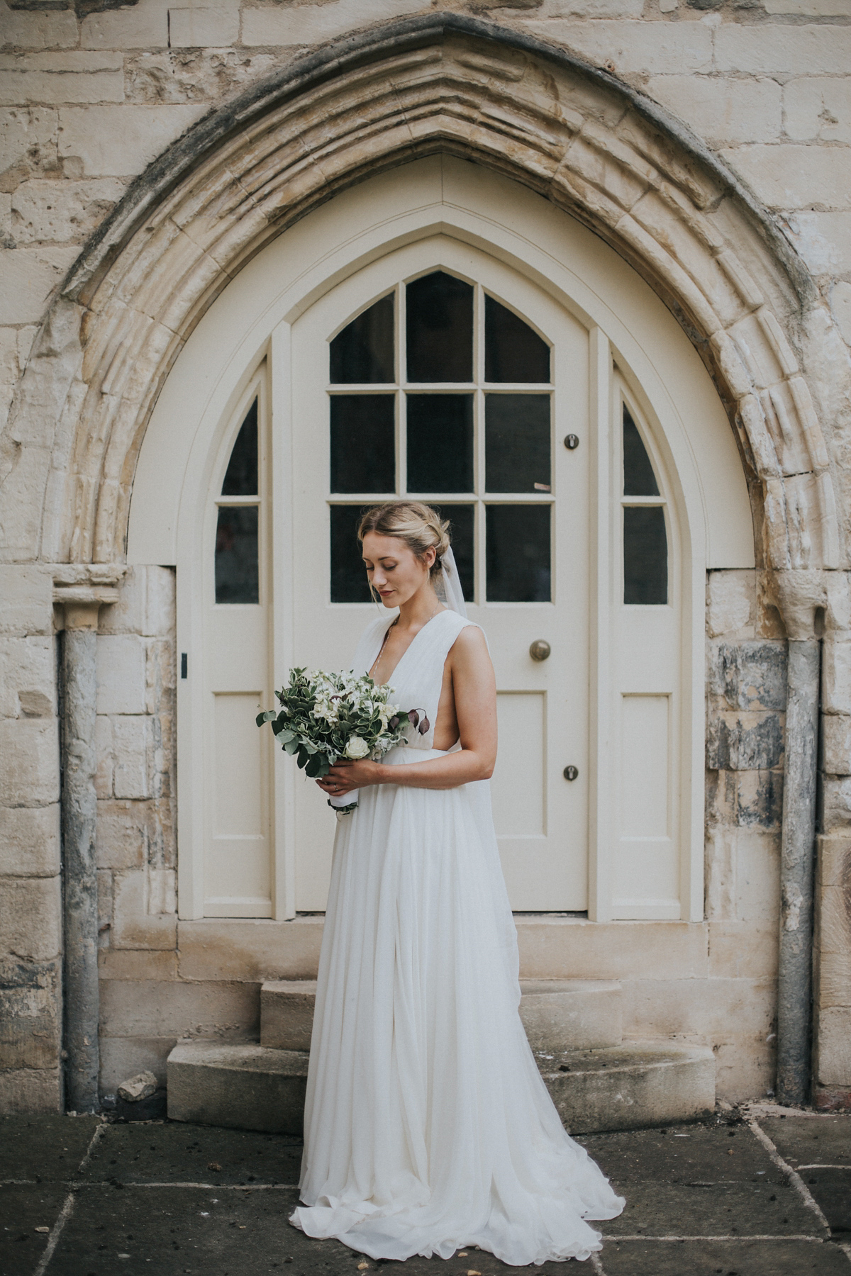 Barefoot bride Zoё wore a dress she had designed herself for her effortlessly elegant wedding at Blackfriar medieval priory in Gloucester. Captured by Grace Elizabeth Photography.