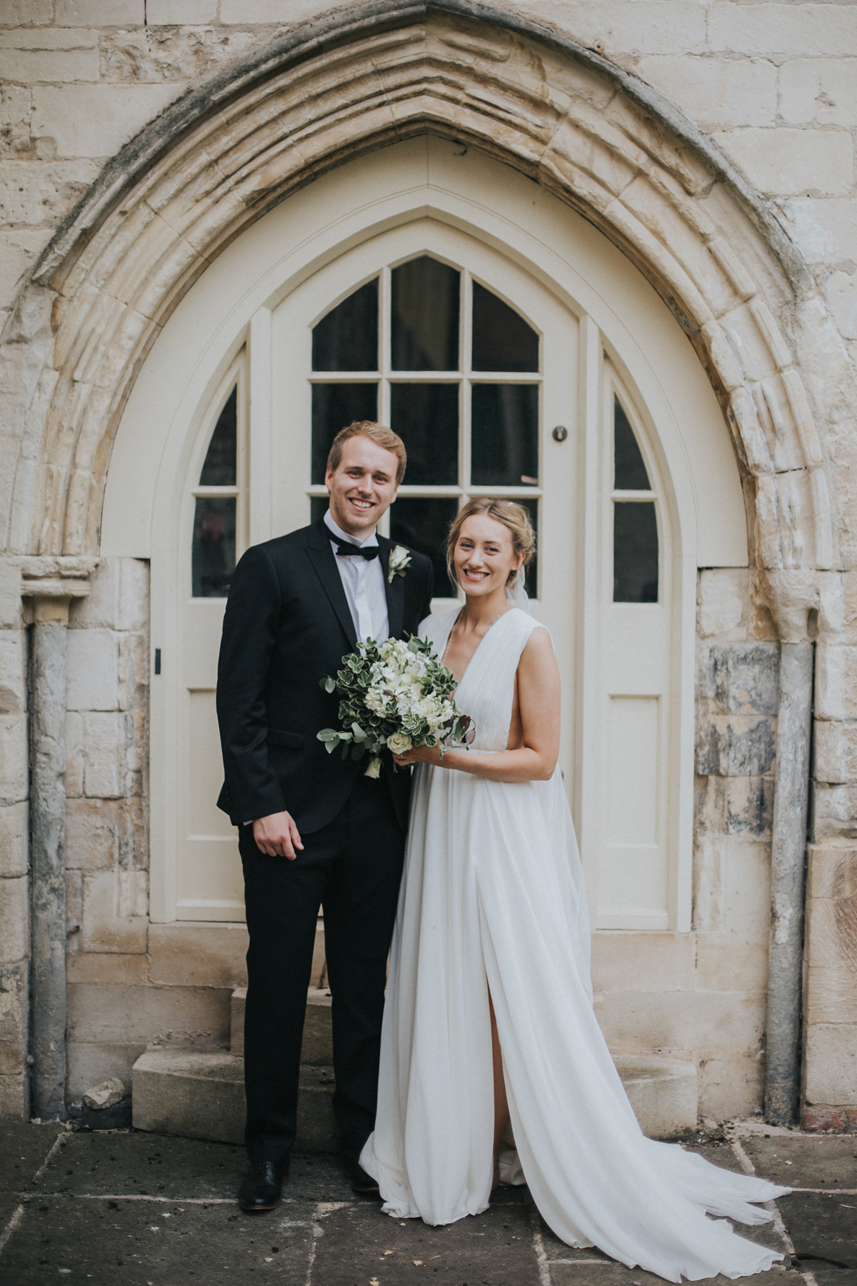 Barefoot bride Zoё wore a dress she had designed herself for her effortlessly elegant wedding at Blackfriar medieval priory in Gloucester. Captured by Grace Elizabeth Photography.