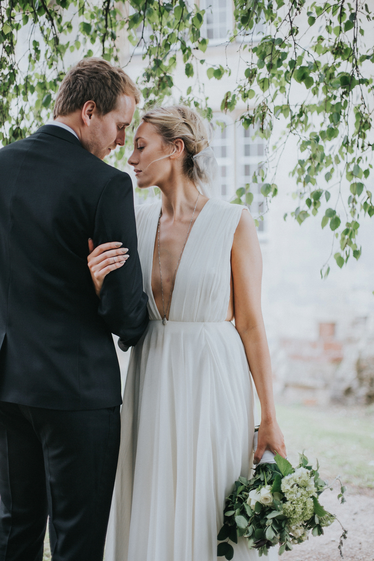 Barefoot bride Zoё wore a dress she had designed herself for her effortlessly elegant wedding at Blackfriar medieval priory in Gloucester. Captured by Grace Elizabeth Photography.