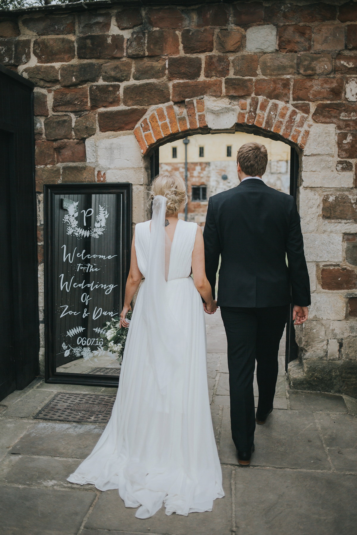 Barefoot bride Zoё wore a dress she had designed herself for her effortlessly elegant wedding at Blackfriar medieval priory in Gloucester. Captured by Grace Elizabeth Photography.