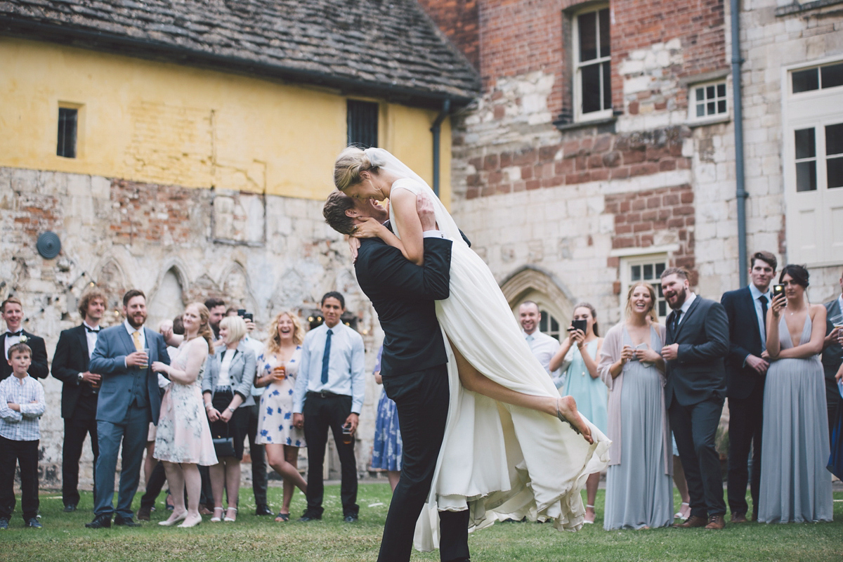 Barefoot bride Zoё wore a dress she had designed herself for her effortlessly elegant wedding at Blackfriar medieval priory in Gloucester. Captured by Grace Elizabeth Photography.