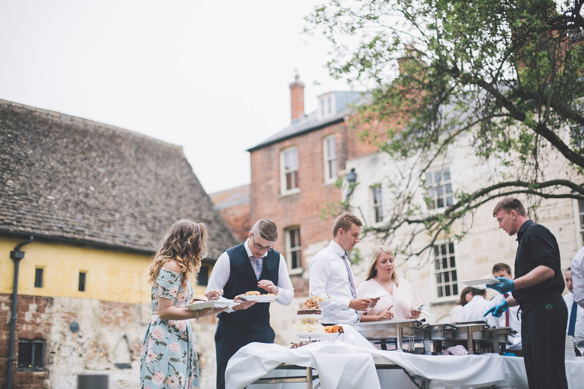 Barefoot bride Zoё wore a dress she had designed herself for her effortlessly elegant wedding at Blackfriar medieval priory in Gloucester. Captured by Grace Elizabeth Photography.