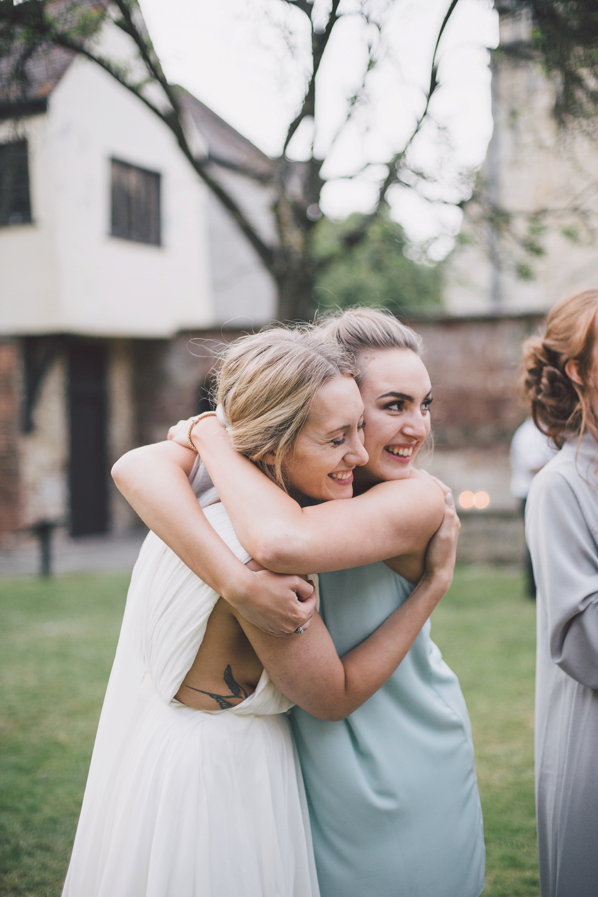 Barefoot bride Zoё wore a dress she had designed herself for her effortlessly elegant wedding at Blackfriar medieval priory in Gloucester. Captured by Grace Elizabeth Photography.