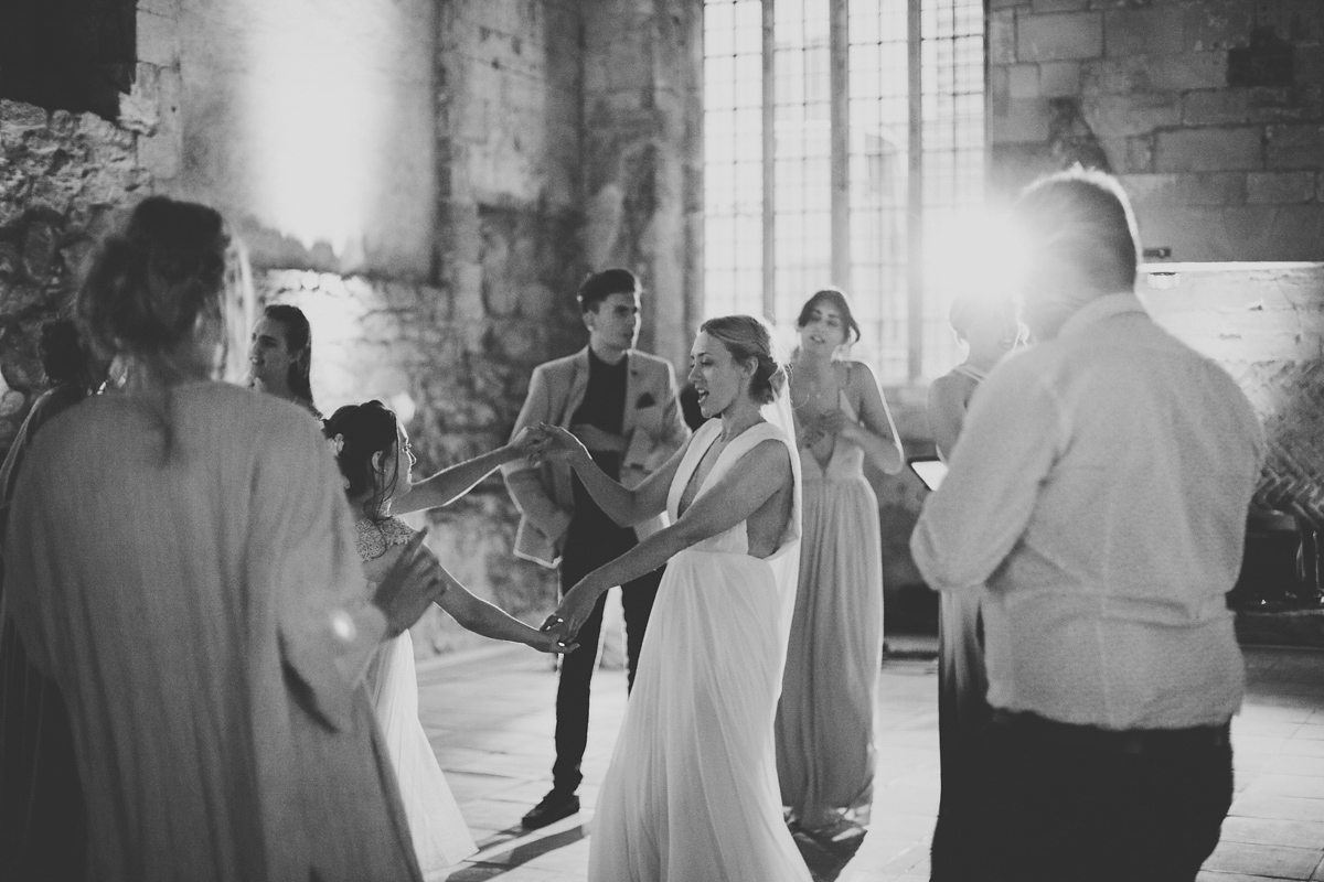 Barefoot bride Zoё wore a dress she had designed herself for her effortlessly elegant wedding at Blackfriar medieval priory in Gloucester. Captured by Grace Elizabeth Photography.