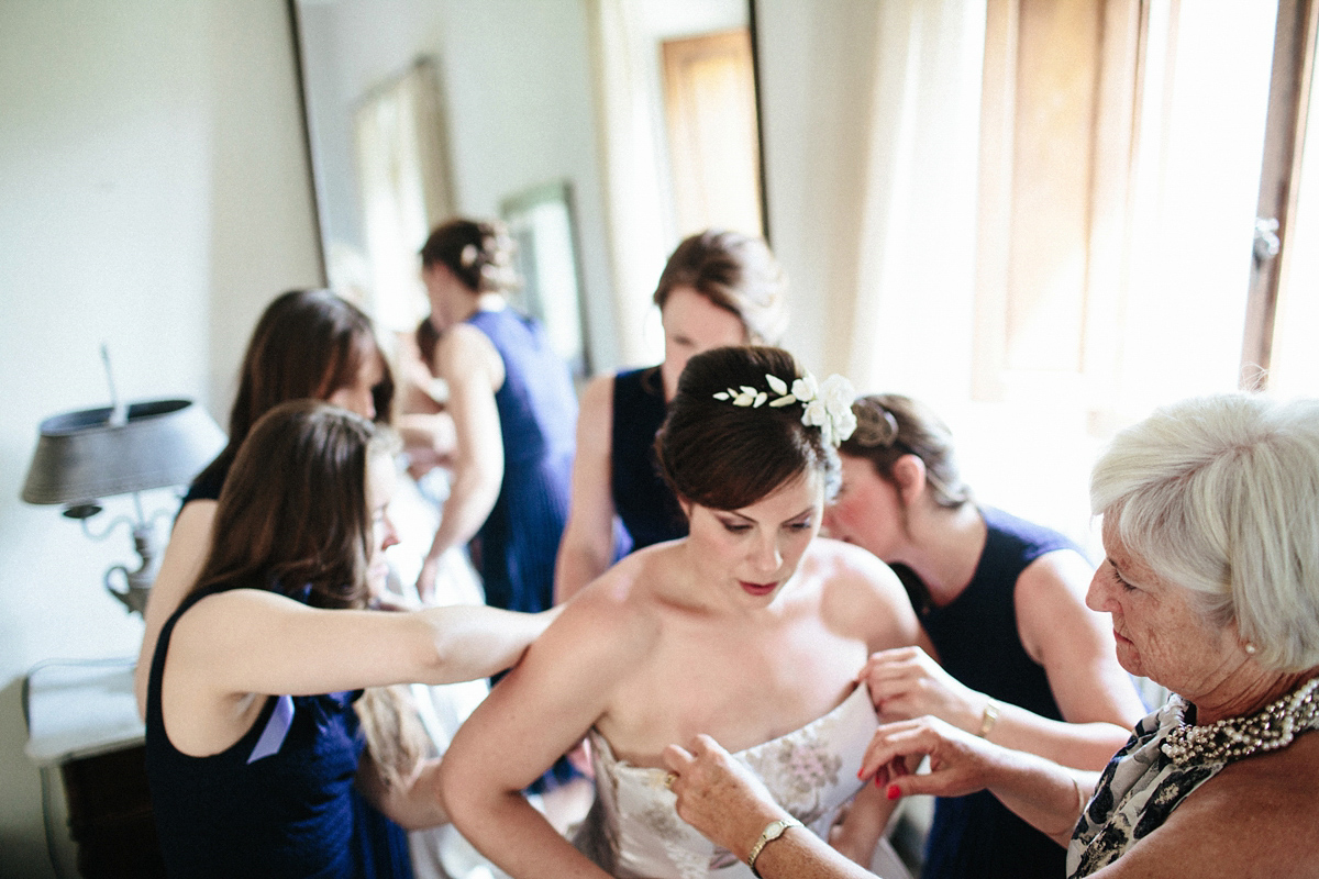 Bride Lucy wore a gold floral Vera Wang gown for her romantic outdoor wedding in the Italian countryside. Images captured by Claudia Rose Carter.