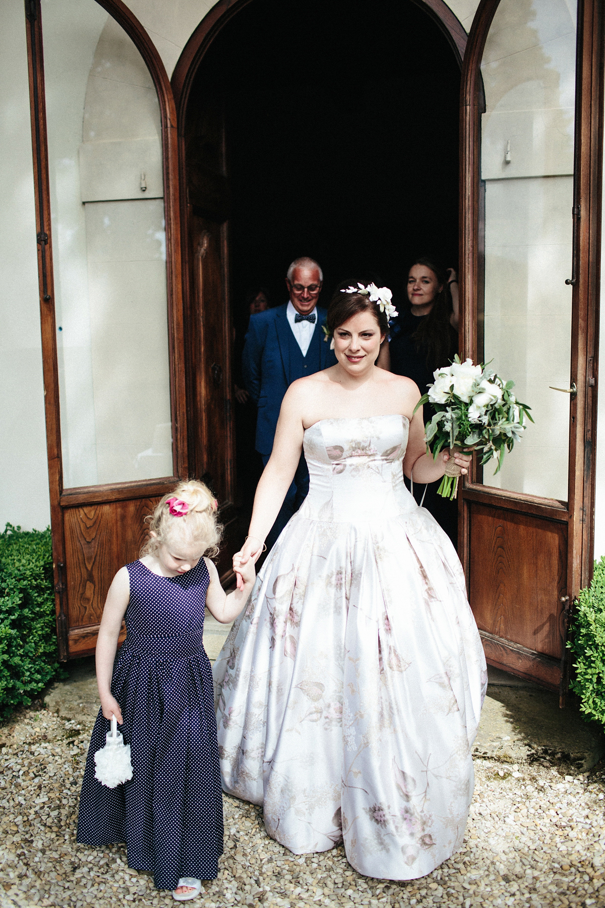 Bride Lucy wore a gold floral Vera Wang gown for her romantic outdoor wedding in the Italian countryside. Images captured by Claudia Rose Carter.