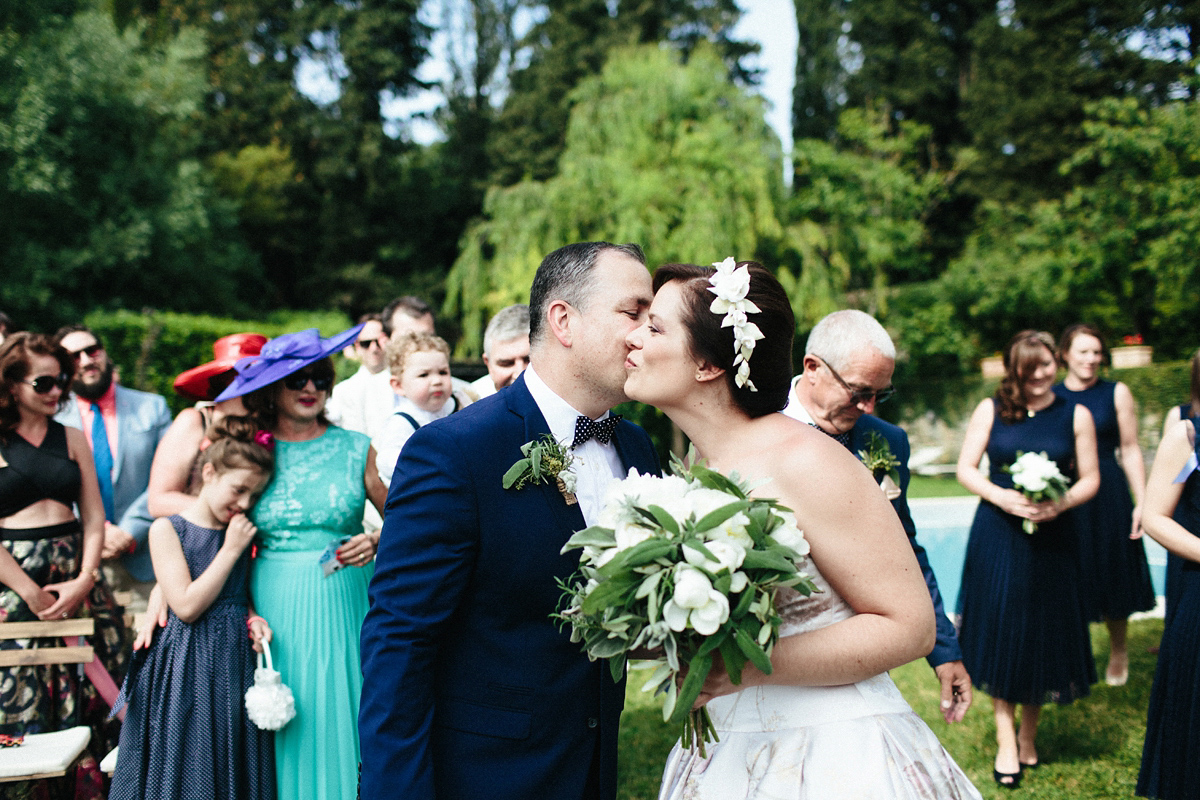 Bride Lucy wore a gold floral Vera Wang gown for her romantic outdoor wedding in the Italian countryside. Images captured by Claudia Rose Carter.