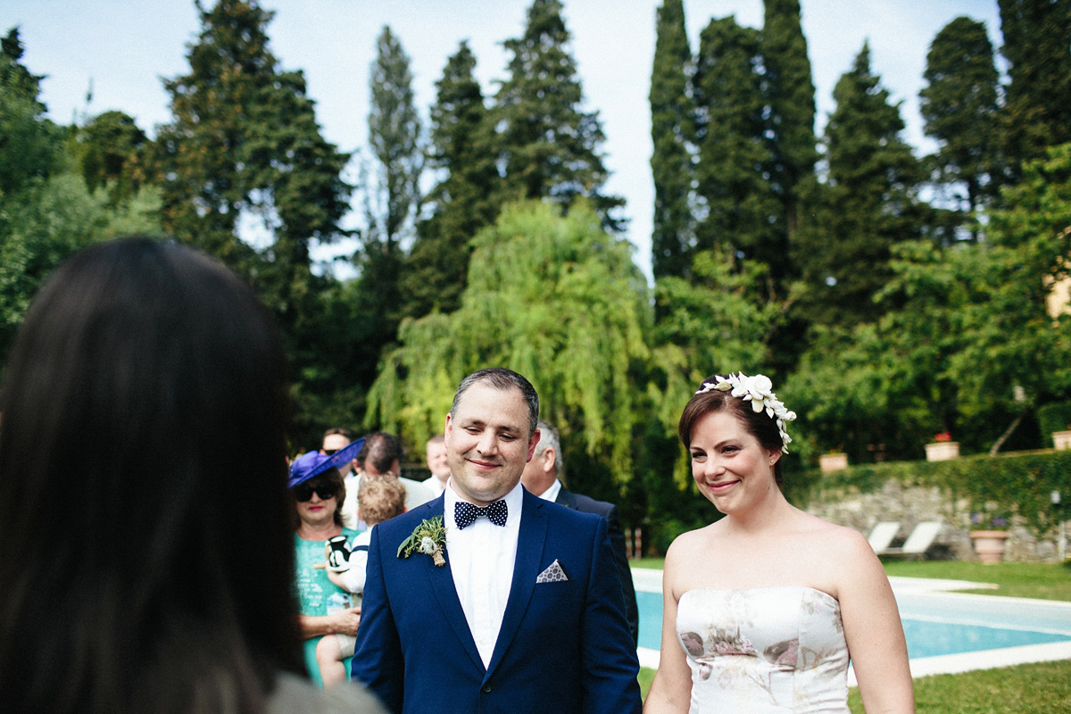 Bride Lucy wore a gold floral Vera Wang gown for her romantic outdoor wedding in the Italian countryside. Images captured by Claudia Rose Carter.