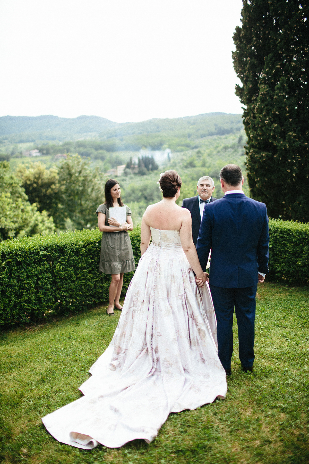 Bride Lucy wore a gold floral Vera Wang gown for her romantic outdoor wedding in the Italian countryside. Images captured by Claudia Rose Carter.