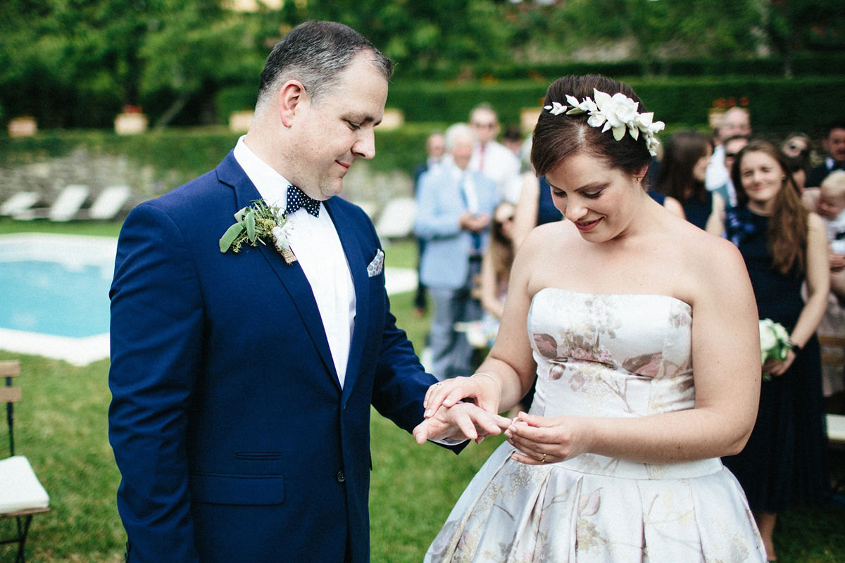 Bride Lucy wore a gold floral Vera Wang gown for her romantic outdoor wedding in the Italian countryside. Images captured by Claudia Rose Carter.