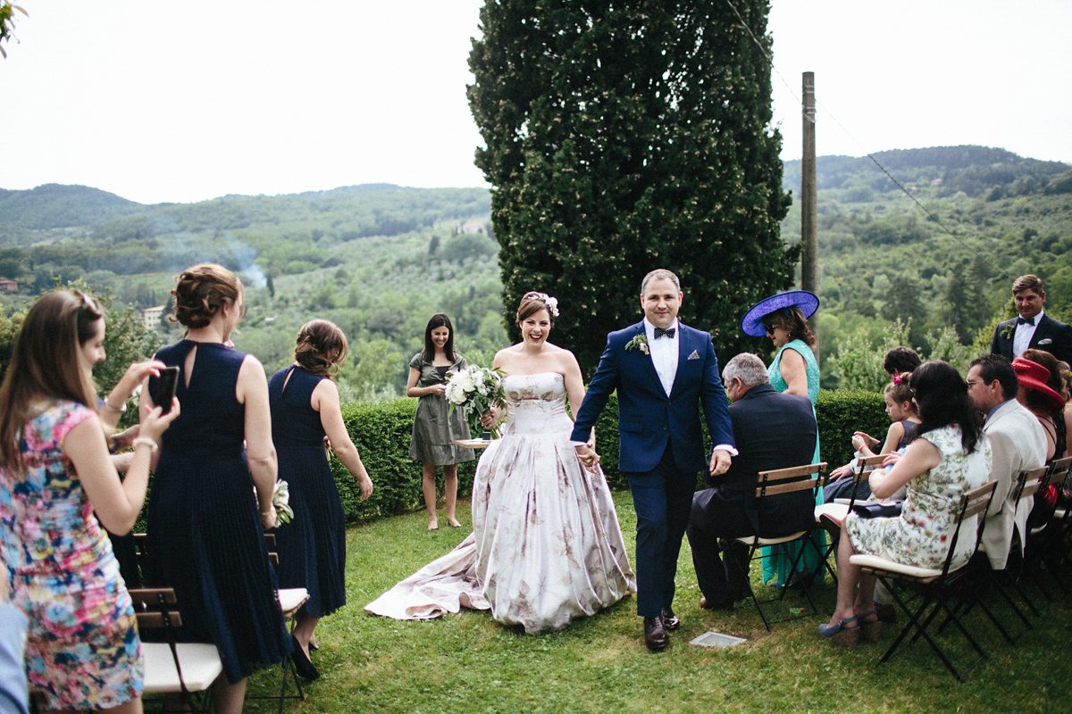 Bride Lucy wore a gold floral Vera Wang gown for her romantic outdoor wedding in the Italian countryside. Images captured by Claudia Rose Carter.