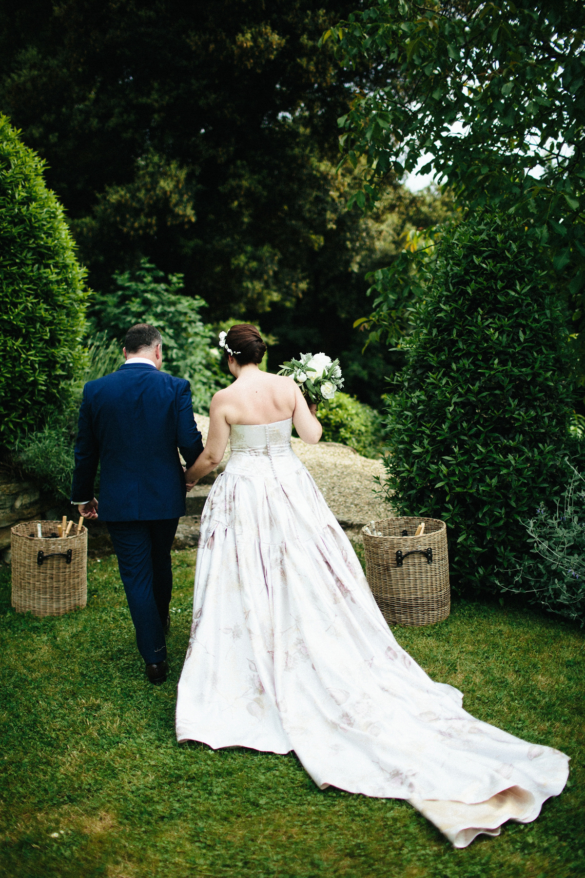 Bride Lucy wore a gold floral Vera Wang gown for her romantic outdoor wedding in the Italian countryside. Images captured by Claudia Rose Carter.