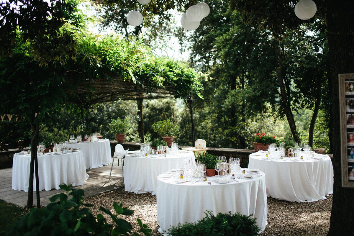 Bride Lucy wore a gold floral Vera Wang gown for her romantic outdoor wedding in the Italian countryside. Images captured by Claudia Rose Carter.