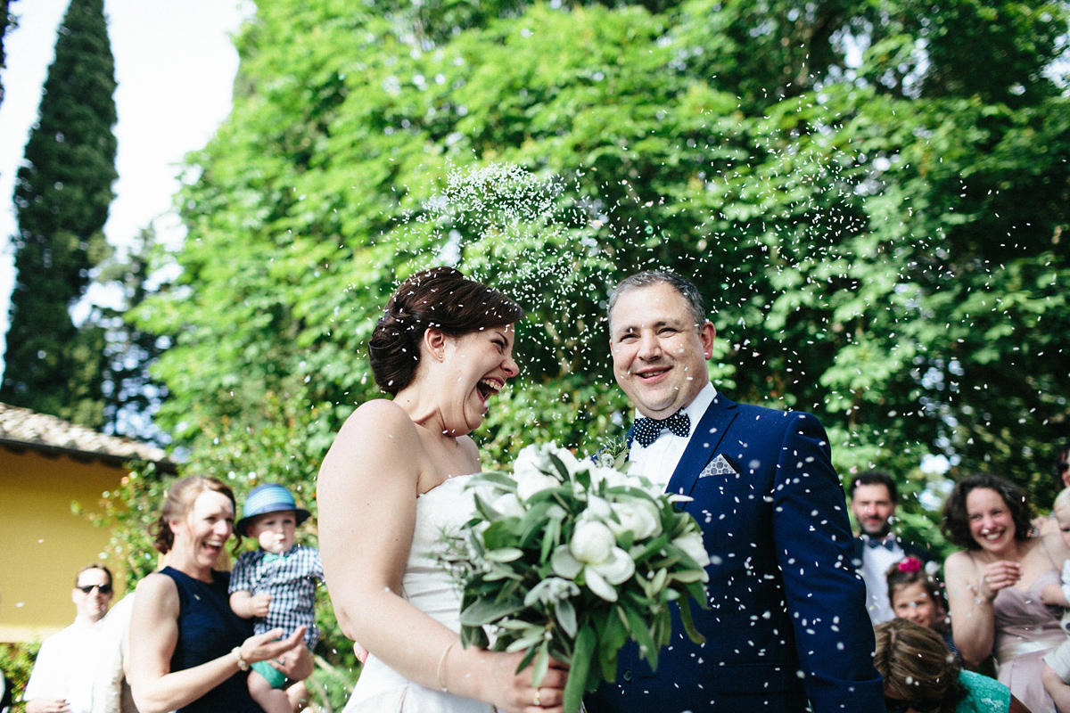 Bride Lucy wore a gold floral Vera Wang gown for her romantic outdoor wedding in the Italian countryside. Images captured by Claudia Rose Carter.