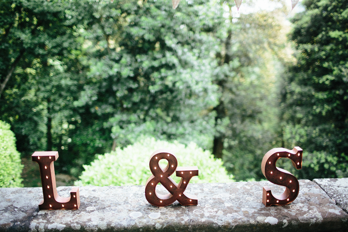 Bride Lucy wore a gold floral Vera Wang gown for her romantic outdoor wedding in the Italian countryside. Images captured by Claudia Rose Carter.