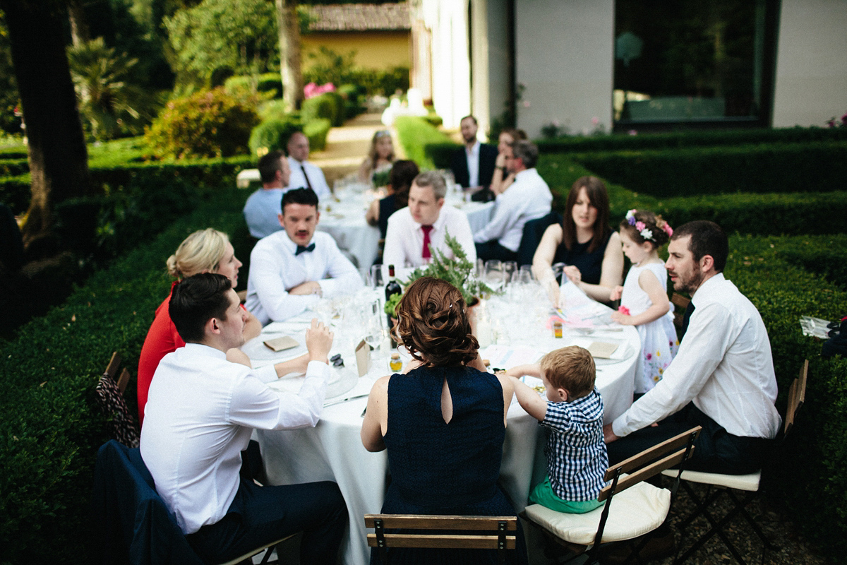 Bride Lucy wore a gold floral Vera Wang gown for her romantic outdoor wedding in the Italian countryside. Images captured by Claudia Rose Carter.