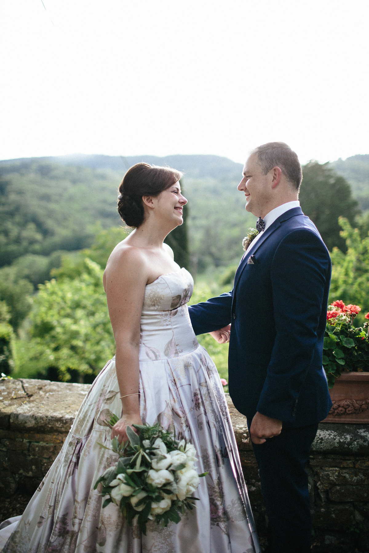 Bride Lucy wore a gold floral Vera Wang gown for her romantic outdoor wedding in the Italian countryside. Images captured by Claudia Rose Carter.