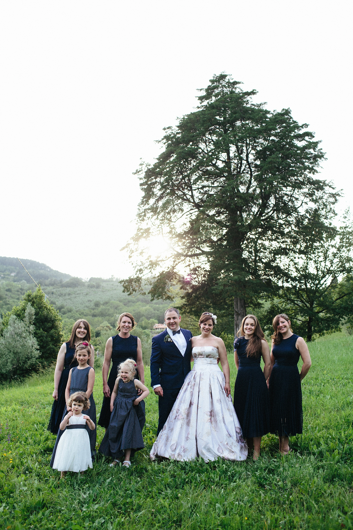 Bride Lucy wore a gold floral Vera Wang gown for her romantic outdoor wedding in the Italian countryside. Images captured by Claudia Rose Carter.