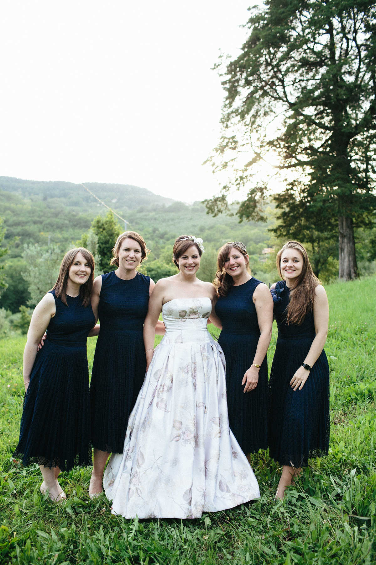 Bride Lucy wore a gold floral Vera Wang gown for her romantic outdoor wedding in the Italian countryside. Images captured by Claudia Rose Carter.