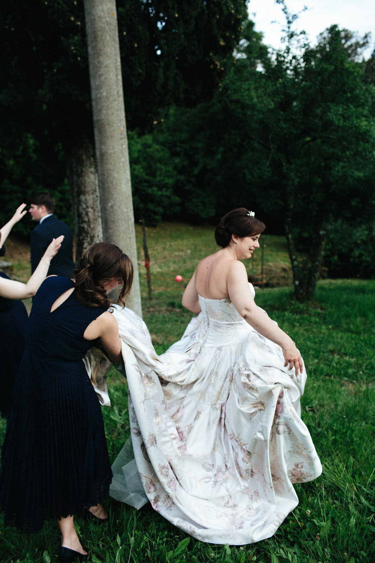 Bride Lucy wore a gold floral Vera Wang gown for her romantic outdoor wedding in the Italian countryside. Images captured by Claudia Rose Carter.