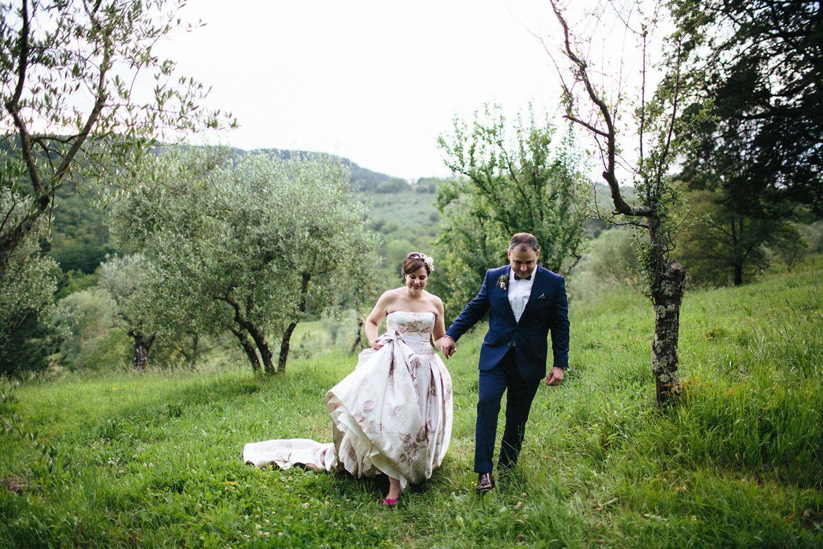 Bride Lucy wore a gold floral Vera Wang gown for her romantic outdoor wedding in the Italian countryside. Images captured by Claudia Rose Carter.