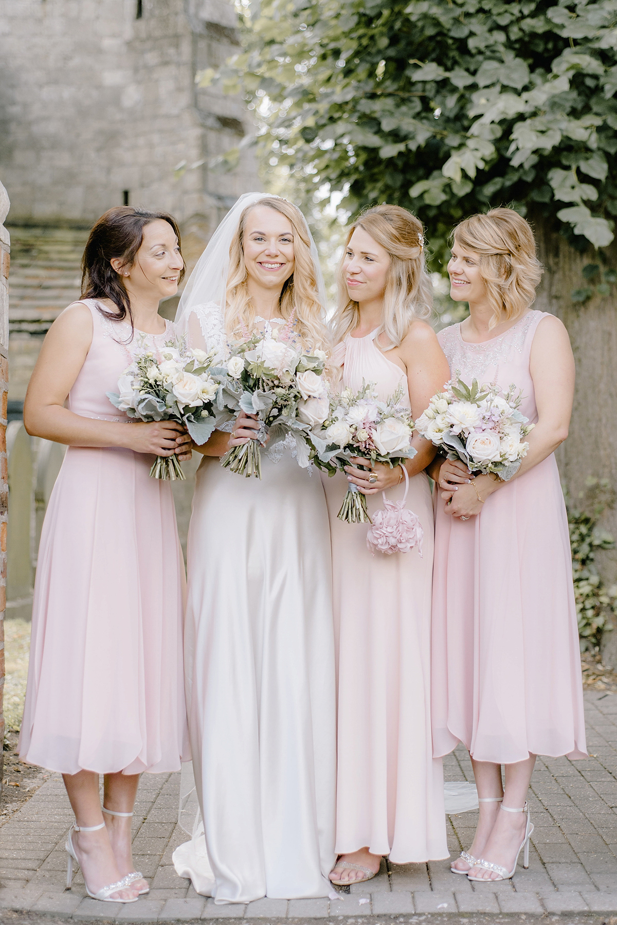 Dani wore a Justin Alexander gown for her relaxed and romantic English country wedding. Fine art film photography by Georgina Harrison.