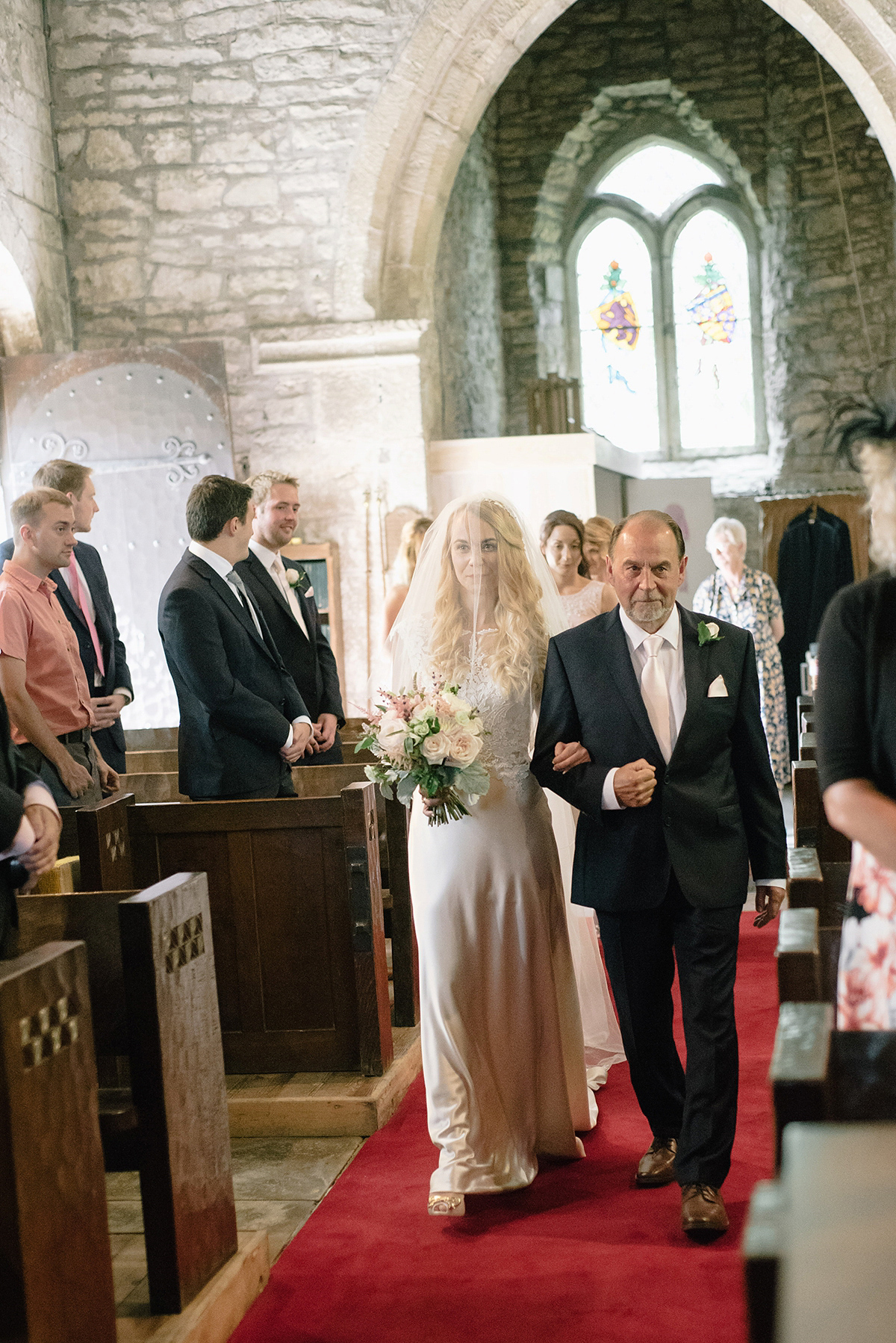 Dani wore a Justin Alexander gown for her relaxed and romantic English country wedding. Fine art film photography by Georgina Harrison.