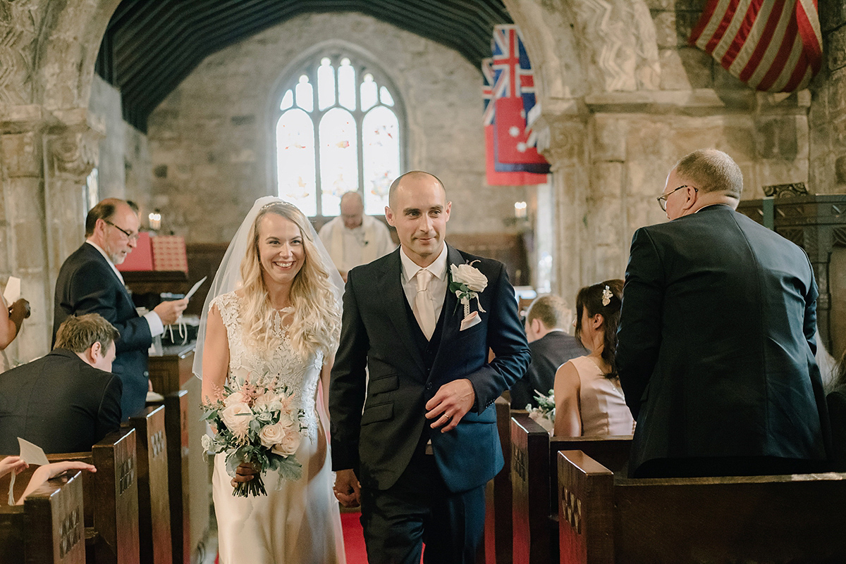 Dani wore a Justin Alexander gown for her relaxed and romantic English country wedding. Fine art film photography by Georgina Harrison.
