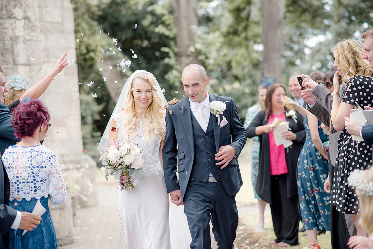 Dani wore a Justin Alexander gown for her relaxed and romantic English country wedding. Fine art film photography by Georgina Harrison.