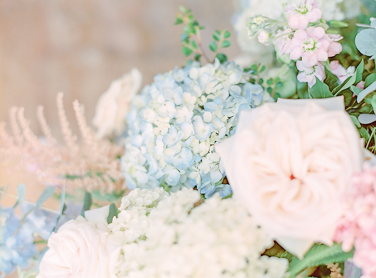 Dani wore a Justin Alexander gown for her relaxed and romantic English country wedding. Fine art film photography by Georgina Harrison.