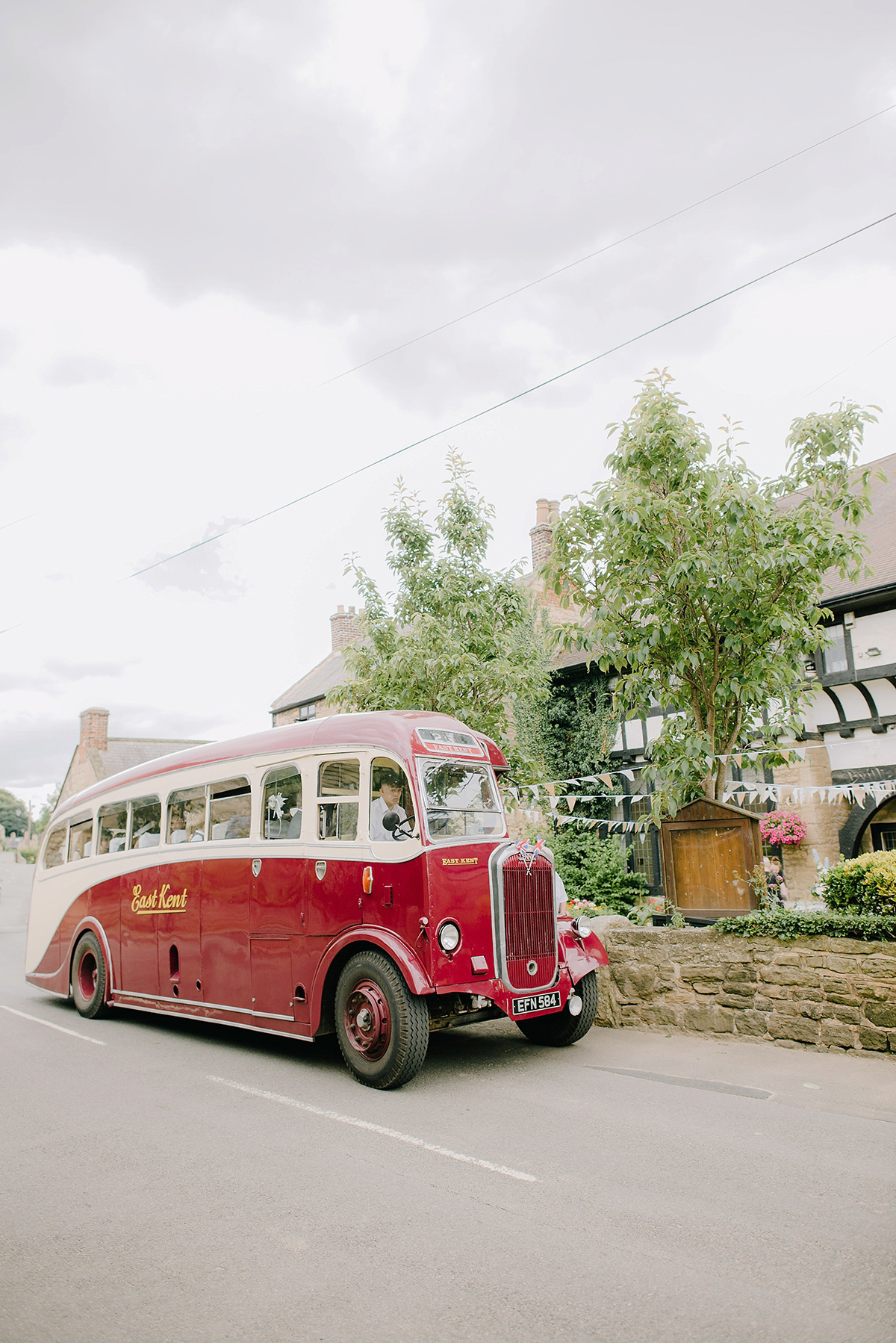 Dani wore a Justin Alexander gown for her relaxed and romantic English country wedding. Fine art film photography by Georgina Harrison.