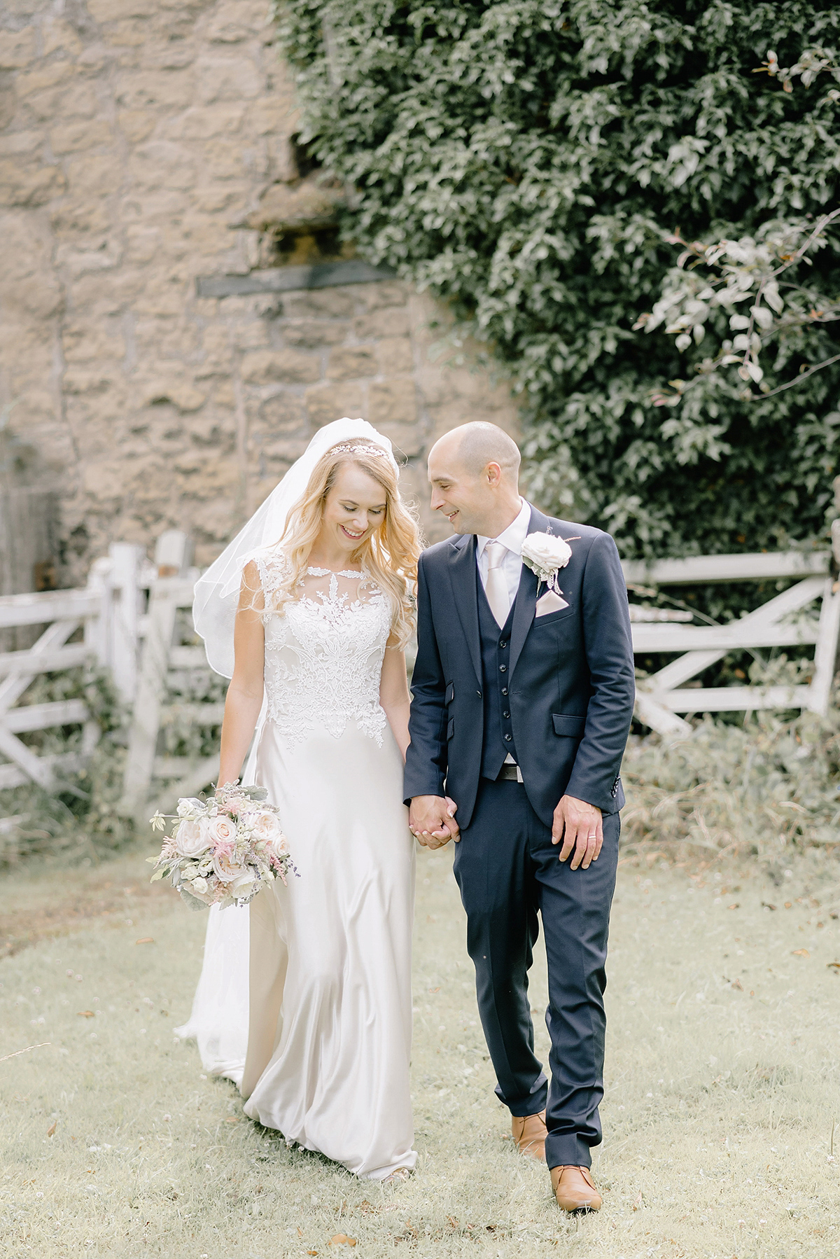 Dani wore a Justin Alexander gown for her relaxed and romantic English country wedding. Fine art film photography by Georgina Harrison.