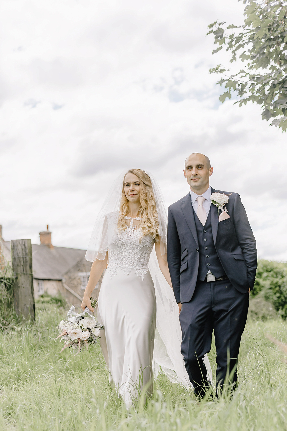 Dani wore a Justin Alexander gown for her relaxed and romantic English country wedding. Fine art film photography by Georgina Harrison.