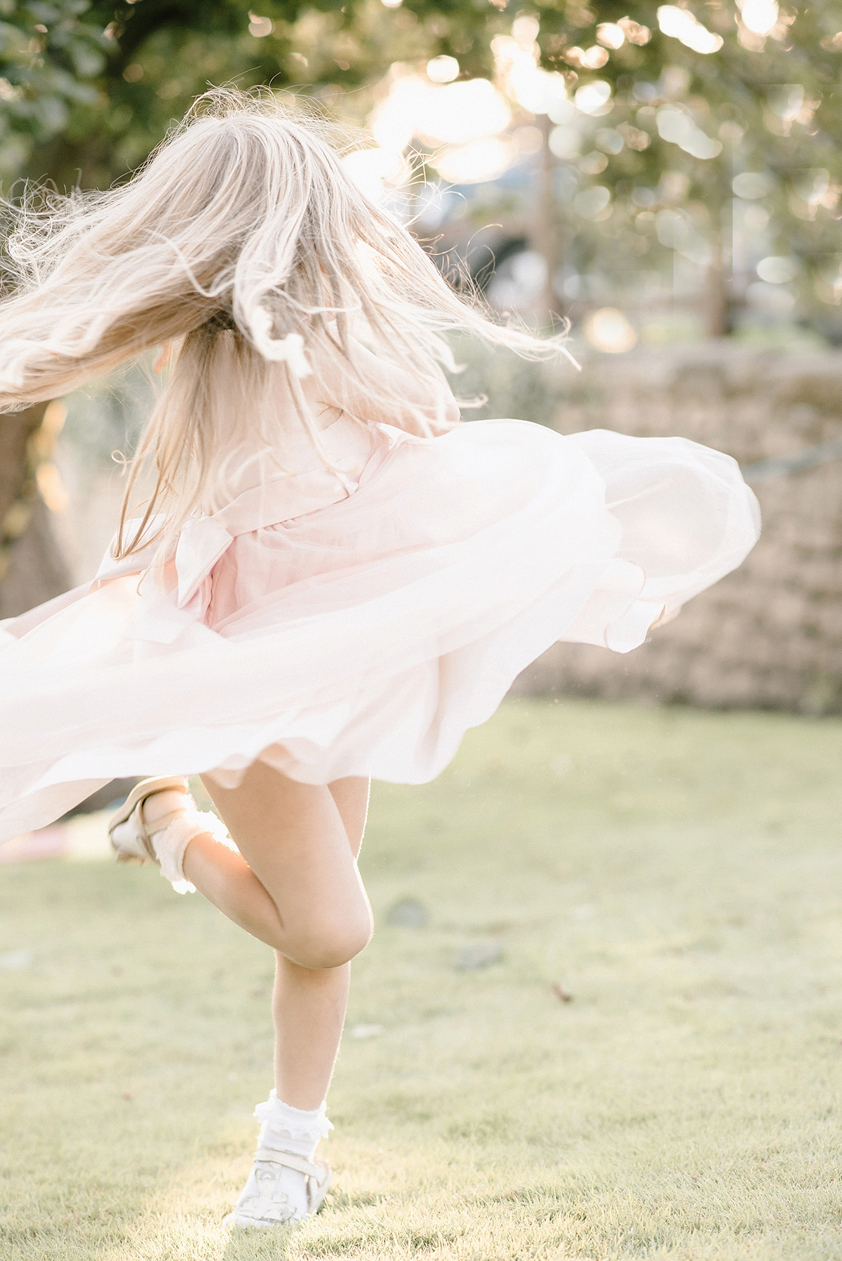 Dani wore a Justin Alexander gown for her relaxed and romantic English country wedding. Fine art film photography by Georgina Harrison.