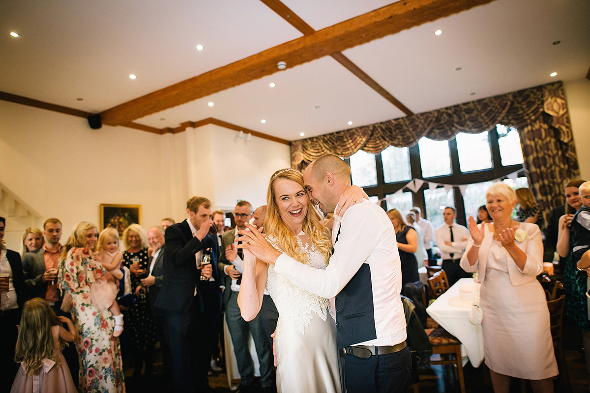 Dani wore a Justin Alexander gown for her relaxed and romantic English country wedding. Fine art film photography by Georgina Harrison.