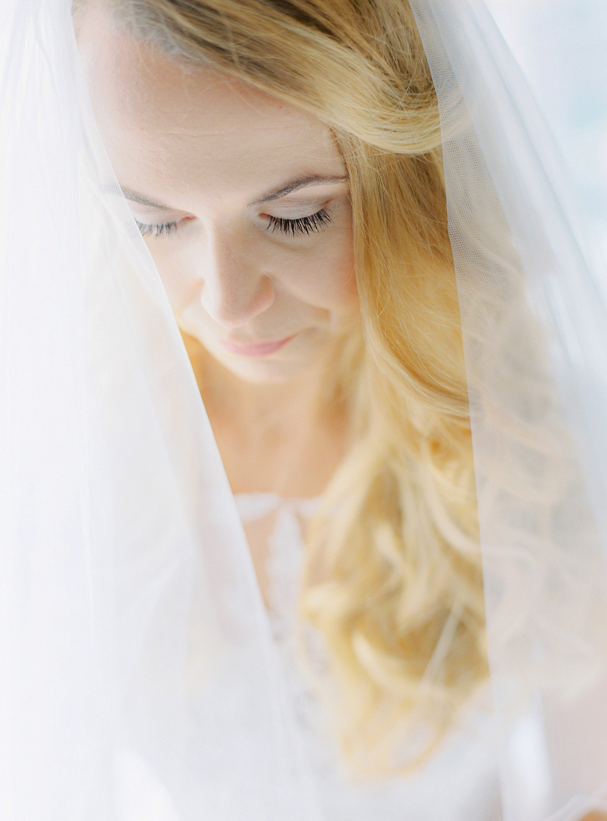 Dani wore a Justin Alexander gown for her relaxed and romantic English country wedding. Fine art film photography by Georgina Harrison.