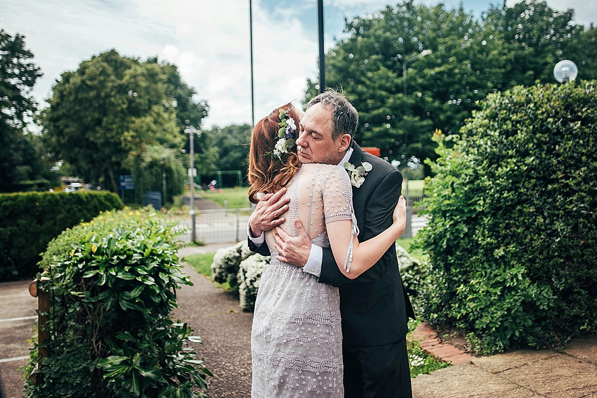 Bride Amelia wore a pale blue/grey Self Portrait dress for her handmade and stripped back, non traditional wedding. Captured by Three Flowers Photography.