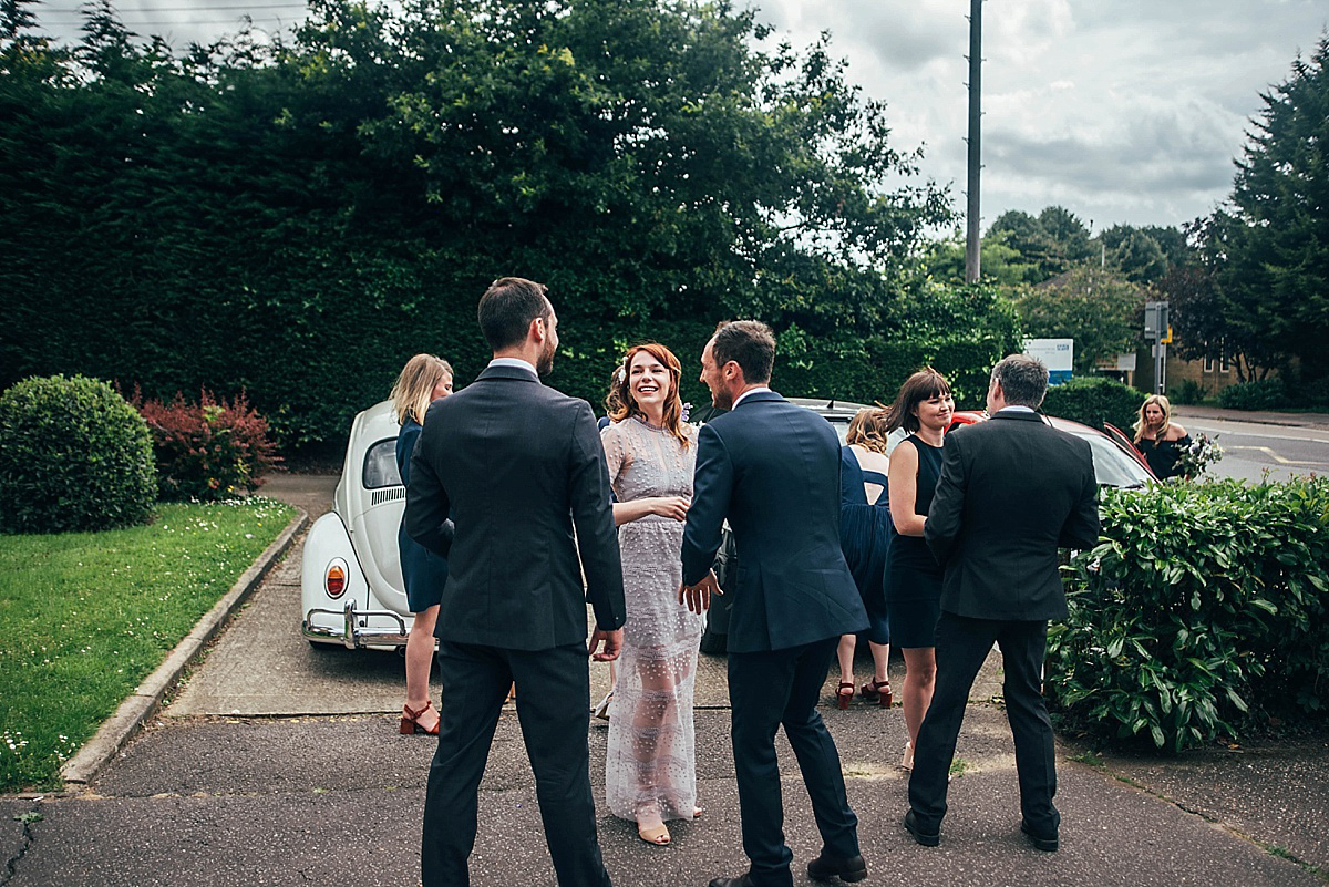 Bride Amelia wore a pale blue/grey Self Portrait dress for her handmade and stripped back, non traditional wedding. Captured by Three Flowers Photography.