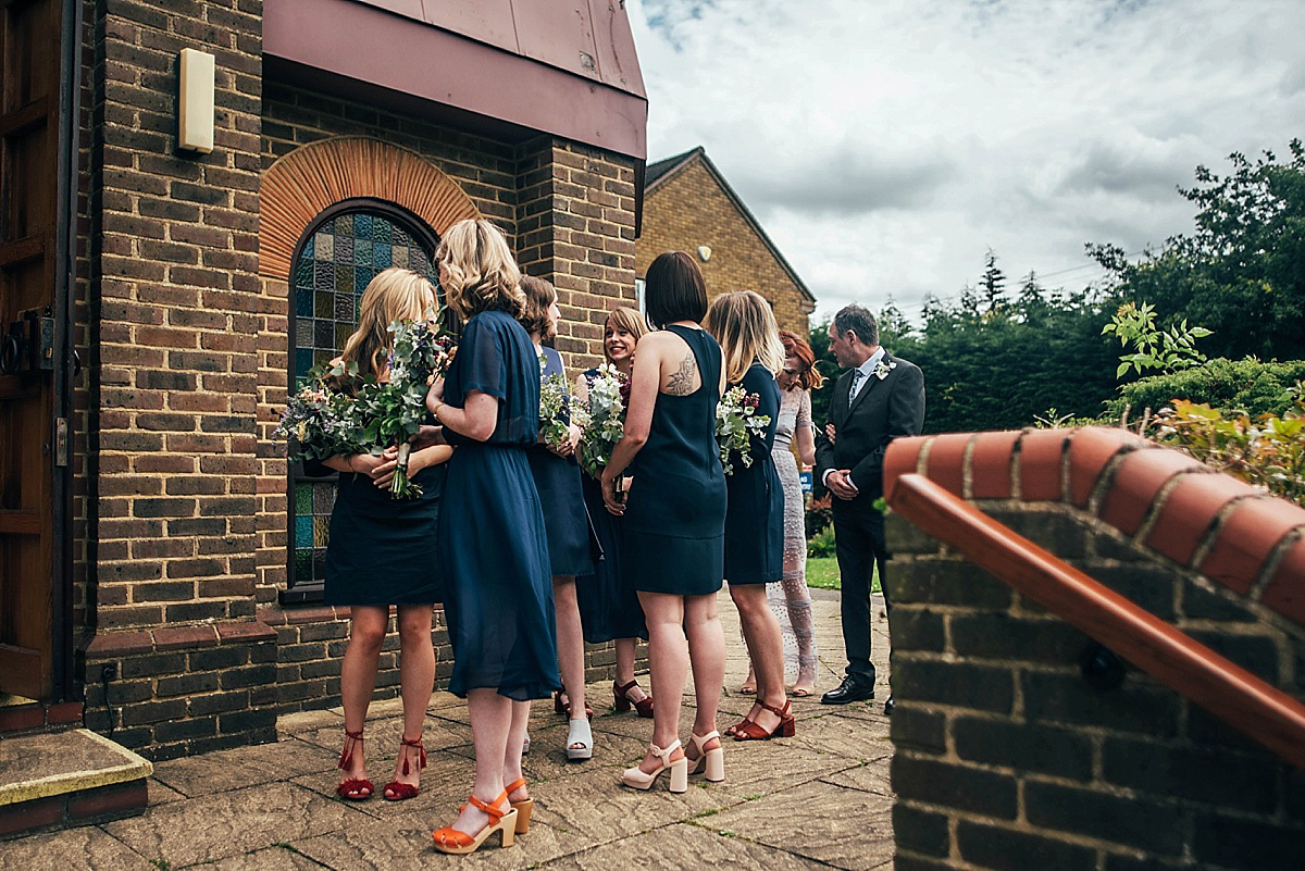 Bride Amelia wore a pale blue/grey Self Portrait dress for her handmade and stripped back, non traditional wedding. Captured by Three Flowers Photography.