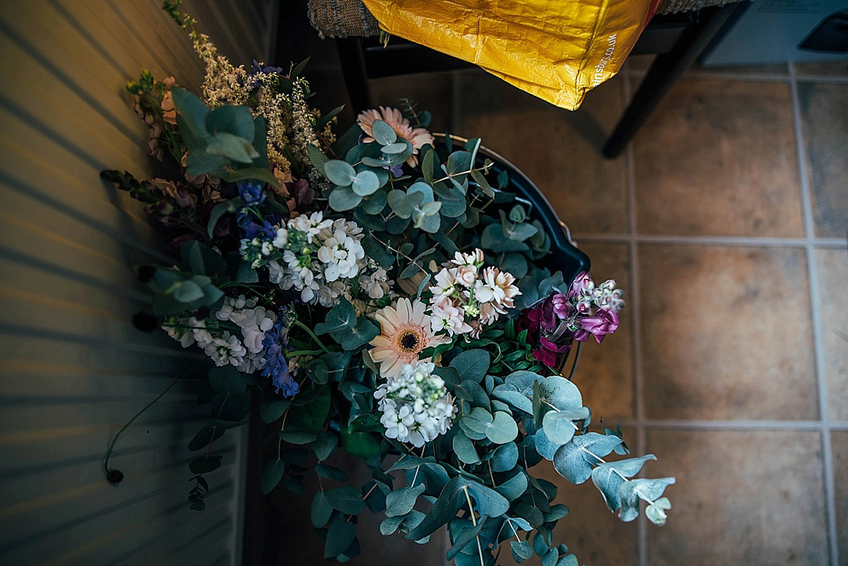 Bride Amelia wore a pale blue/grey Self Portrait dress for her handmade and stripped back, non traditional wedding. Captured by Three Flowers Photography.