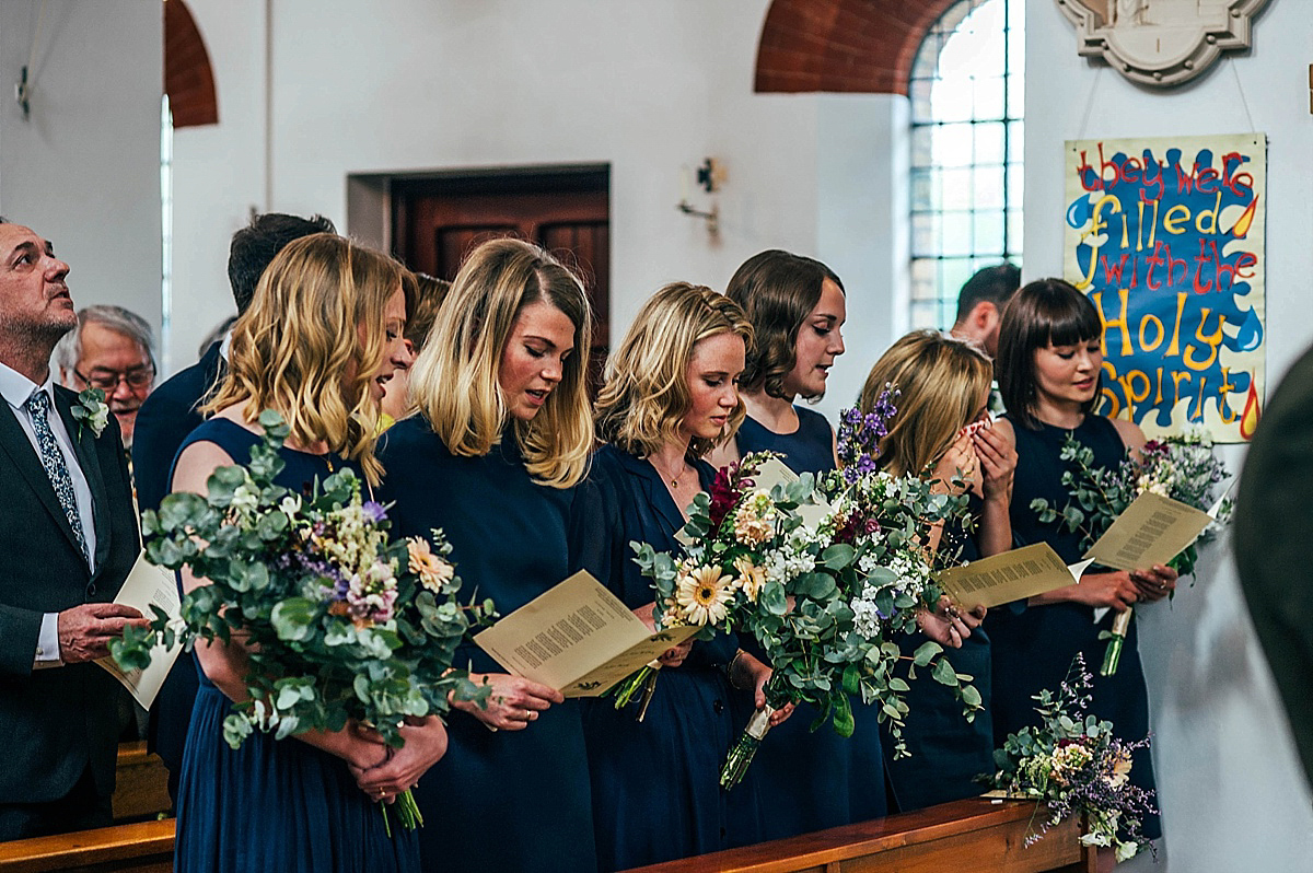 Bride Amelia wore a pale blue/grey Self Portrait dress for her handmade and stripped back, non traditional wedding. Captured by Three Flowers Photography.